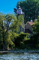 Trees Surround Stone Tower of Windmill Point Lighthouse